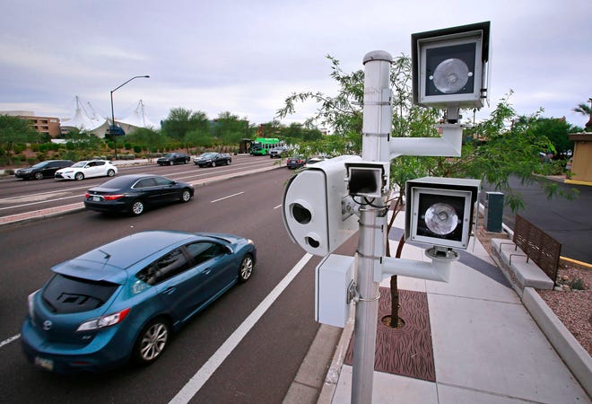 A traffic enforcement camera is shown at the intersection of McDowell and Scottsdale roads in Scottsdale.