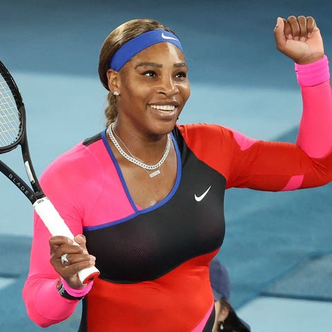 Serena Williams celebrates beating  Simona Halep d