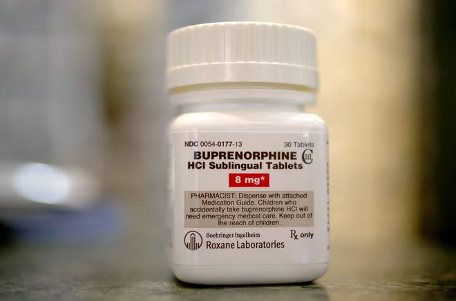 A bottle of the generic prescription pain medication buprenorphine is seen in a pharmacy. The narcotic drug is used as an alternative to Methadone to help addicts recovering from heroin use. As opioid overdose deaths spike during the pandemic, doctors are asking the federal government to make it easier to prescribe the lifesaving drug.