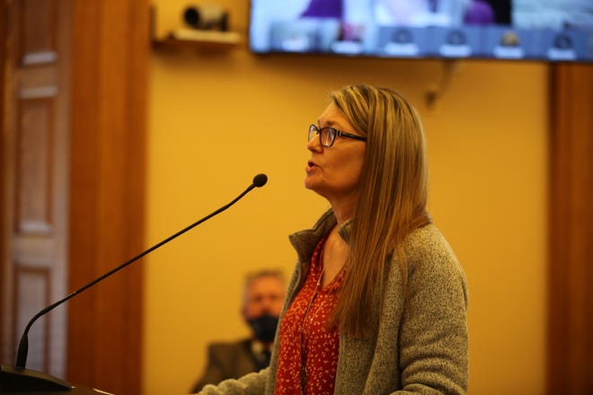 Heidi Beal, testifying Wednesday before a Kansas House committee, is one of several individuals advocating for change within the state's foster care system.