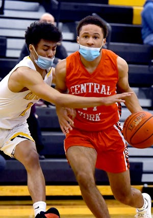 Central York's Steven Betancur drives against pressure from Red Lion's AJ Virata during action at Red Lion Tuesday, Feb. 16, 2021. Red Lion won the game 58-42. Bill Kalina photo 
