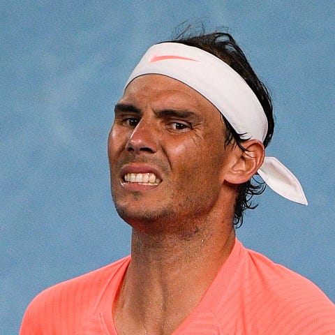 Spain's Rafael Nadal reacts after losing a point a