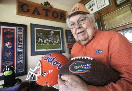 "Gator" Bert Reames shows off some of his University of Florida memorabilia before the big Florida Gators-Georgia Bulldogs football game in 2019. Reames attended UF in 1944 before leaving to serve in the U.S. Army Air Corps during World War II. He moved to Daytona Beach in 1949 and became a local business leader for more than 70 years. He died at his Ormond Beach home Wednesday evening, Feb. 17, 2021. He was 94.
