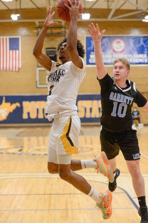 Markei Hampton drives to score two of his 12 points as Potomac State downed Garrett College on Wednesday night at the Lough Gym.