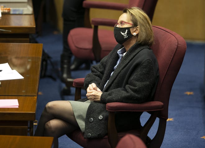Republican state Sen. Wendy Rogers looks on from the Senate floor at the Arizona Capitol on Feb. 18, 2021.