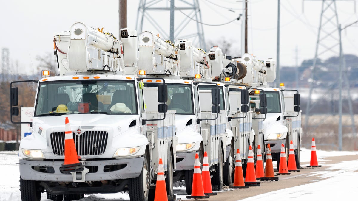 Electric service trucks on Feb. 16, 2021, in Fort Worth, Texas.