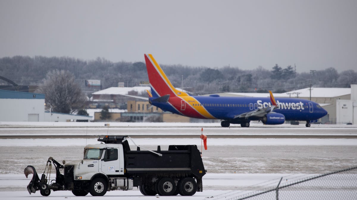 A truck plows the airfield at Nashville International Airport.