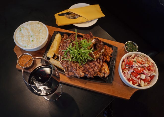 On the menu at the popular Los Andes restaurant is a churrasco-style platter with ribeye served with sides of fried yucca and more.