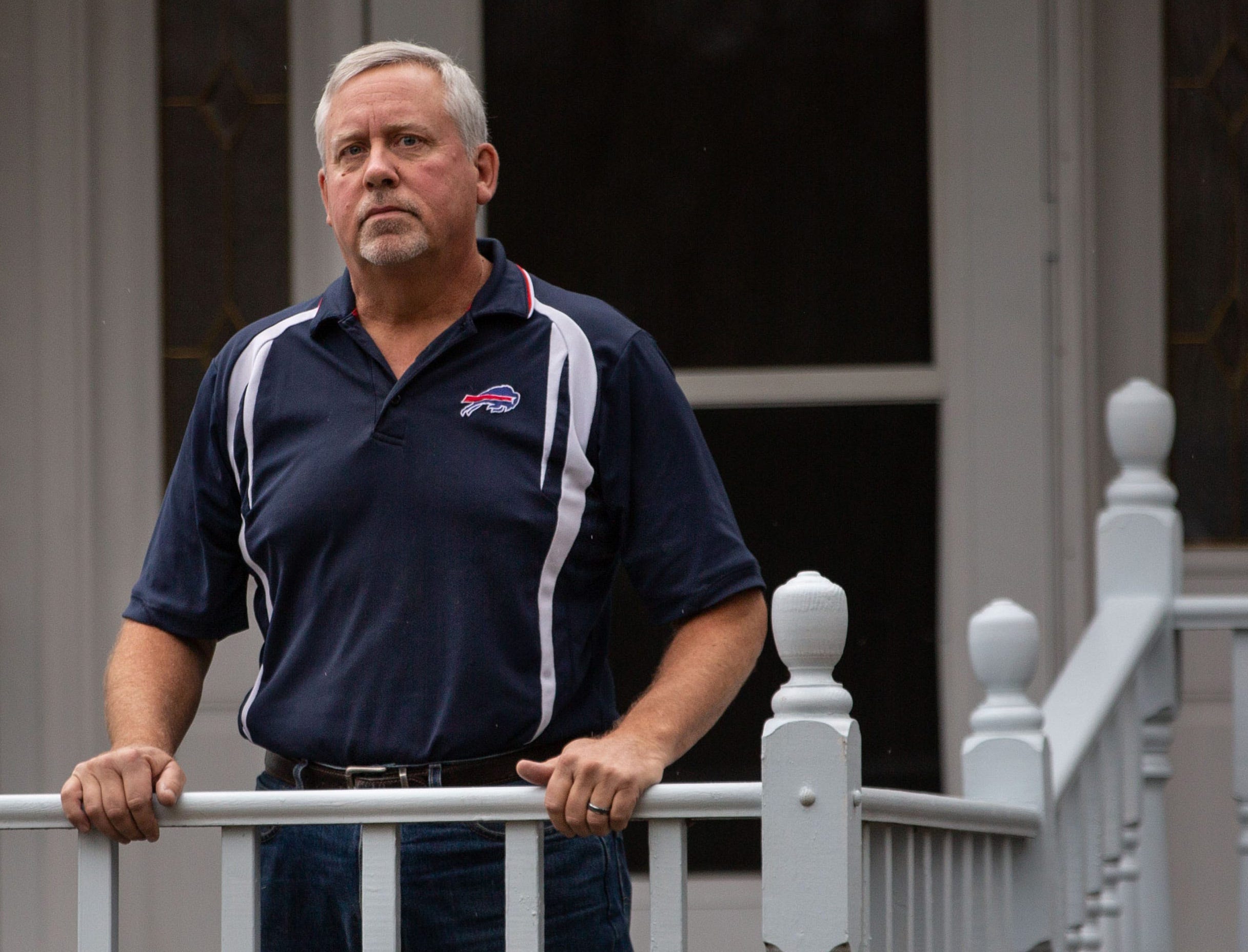 Jeff Morehouse, a former police officer in the village of Penn Yan, stands on his front porch on Monday, Dec. 14, 2020.