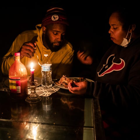 Howard and Nena Mamou eat dinner at their home in 