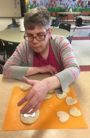 Joy, a  Sunshine Resources of Door County client, works on some cookies in Sunshine House Day Services, where clients can learn to make meals and desserts, explore their artistic abilities with crafts and projects and learn about the fun things in life.