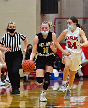 Delone Catholic's Abigael Vingsen, left, moves the ball down the court while Cumberland Valley's Ella Steinbrook defends during girls' basketball action at Cumberland Valley High School in Mechanicsburg, Saturday, Feb. 20, 2021. Cumberland Valley would win the game 65-42. Dawn J. Sagert photo