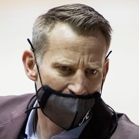 Nate Oats signals his team during the first half o