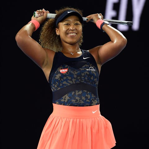 Naomi Osaka reacts after winning a point against J