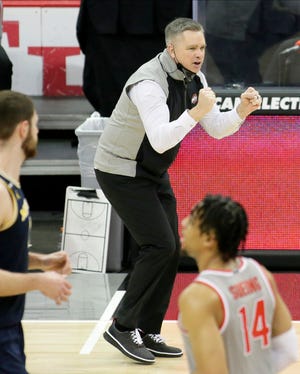 Ohio State Buckeyes head coach Chris Holtmann cheers on his team during Sunday's NCAA Division I Big Ten conference basketball game against the Michigan Wolverines at Value City Arena in Columbus, Ohio, on February 21, 2021.