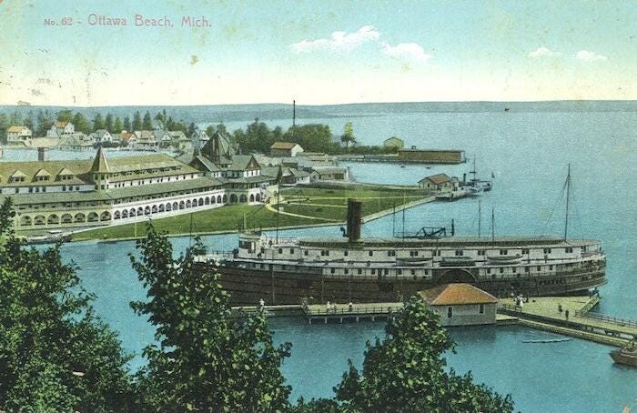 Ottawa Beach Hotel was the subject of many postcards. In this card, a steamboat is docked at  Macatawa Park across the bay. The hotel is shown after its move to the lakefront and a significant expansion on its west side.