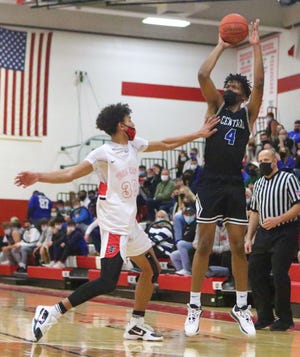 Brookfield Central's David Joplin (shooting) and Wauwatosa East's Charles Alexander Singleton both were named to the Wisconsin Basketball Coaches Association Division 1 all-state team.