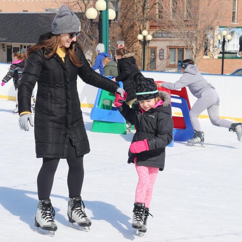Daniele Schulz, left, helps Tayleigh Whisker, both