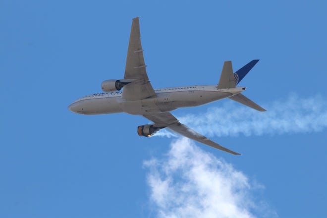This Saturday, Feb. 20, 2021 photo provided by Hayden Smith shows United Airlines Flight 328 approaching Denver International Airport, after experiencing "a right-engine failure" shortly after takeoff from Denver. Federal regulators are investigating what caused a catastrophic engine failure on the plane that rained debris on Denver suburbs as the aircraft made an emergency landing. Authorities said nobody aboard or on the ground was hurt despite large pieces of the engine casing that narrowly missed homes below. (Hayden Smith via AP)