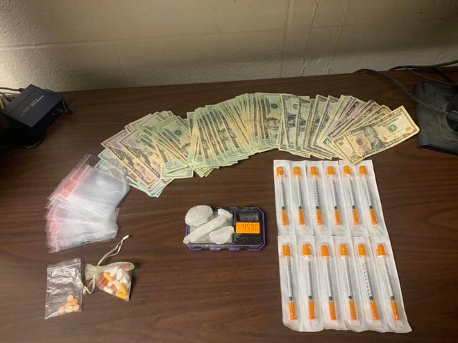 Prescription medications, marijuana, suspected methamphetamine and heroin, drug paraphernalia and more than $1,900 in cash were found during a search of an East Warren Street home.