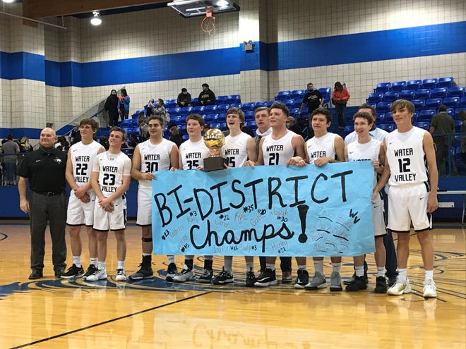 The Water Valley boys basketball team celebrates after defeating Menard 43-33 in their Class 1A bidistrict playoff game Monday, Feb. 22, 2021, in Winters.