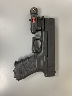 The semiautomatic Glock BB gun recovered from the suspects.