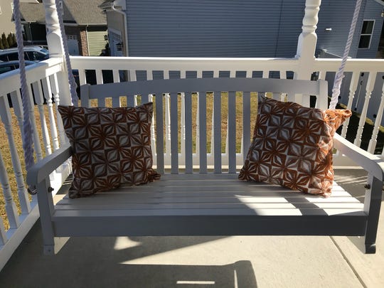 A front porch swing is the perfect place to work.