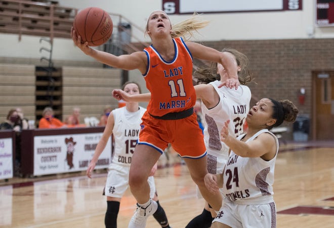 Marshall County’s Cayson Conner (11) takes a shot as the Marshall County Lady Marshals play the Henderson County Lady Colonels in Henderson, Ky., Tuesday evening, Feb. 23, 2021. 