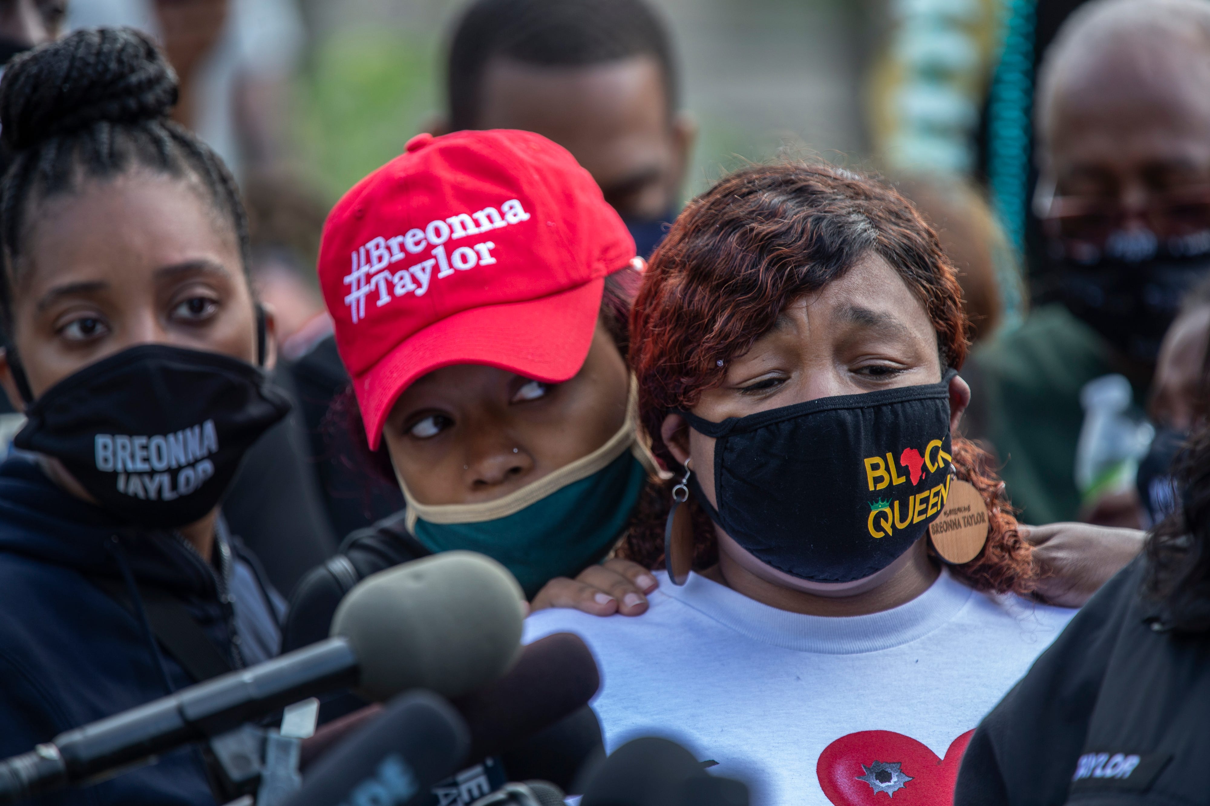 Tamika Palmer, mother of Breonna Taylor, is comforted by her daughter Juniyah, while listening to her sister Bianca Austin speak during a press conference Sept. 25, 2020. The gathering was called to refute the Kentucky Attorney General's grand jury's recommendations in Breonna Taylor's death.