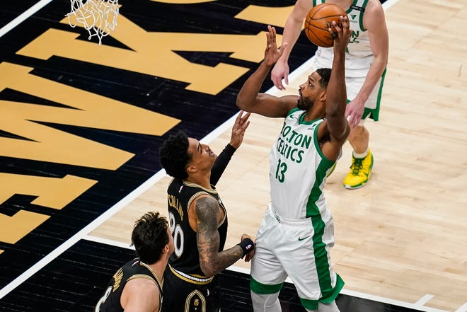 Boston's Tristan Thompson shoots over Atlanta's John Collins during the first half of Wednesday night's game.