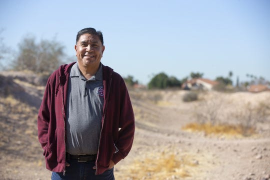 Shane Anton, tribal historic preservation officer for Salt River Pima-Maricopa Indian Community, stands in an ancient canal at the Park of Canals in Mesa. Hohokam created hundreds of miles of canals that supplied irrigation for their crops in the desert of Arizona.