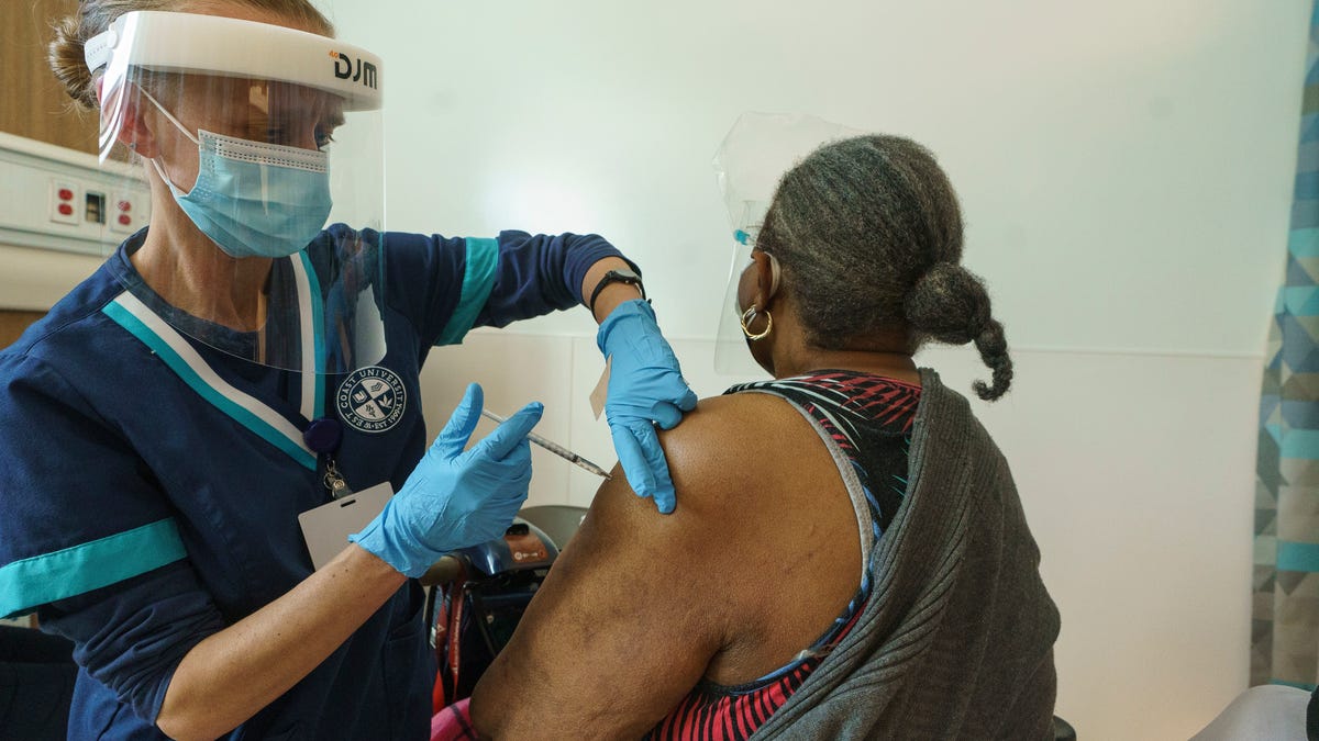 Los Angeles health workers administer COVID-19 vaccinations on Feb. 24.