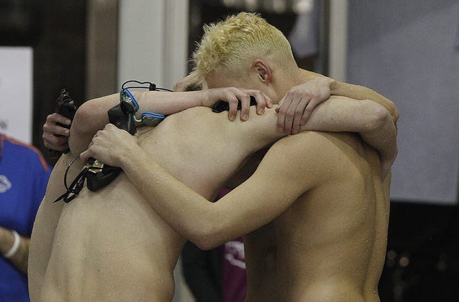 River View 200 yard freestyle relay team of Brayden Karr Reas Pepper, JT Roberts, and Zach Phillips share a hug following their race during the Division II boys state swim meet at CT Branin Natatorium in Canton on Thursday February 25, 2021.