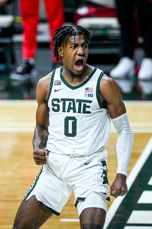 Michigan State's Aaron Henry celebrate after a dunk against Ohio State during the first half on Thursday, Feb. 25, 2021, at the Breslin Center in East Lansing.