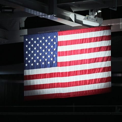 The National Anthem plays before the Milwaukee Buc