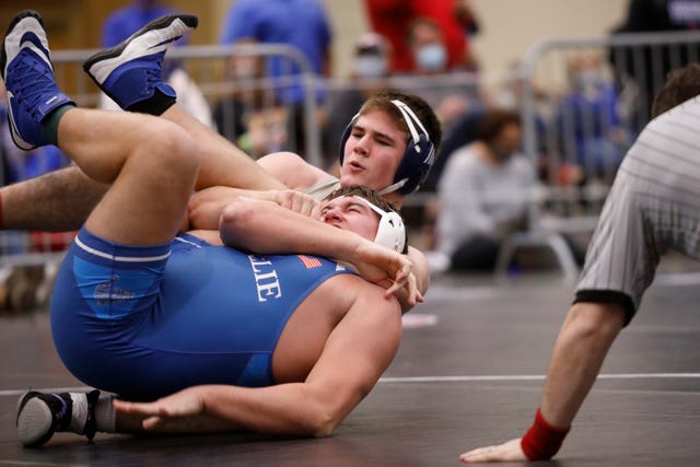 Father Ryan's Parker Petersen, top, pins McCallie's Lauren McDonald to win their TSSAA Division-II state wrestling tournament 285-lb championship bout at the Chattanooga Convention Center on Thursday, Feb. 25, 2021, in Chattanooga, Tenn.