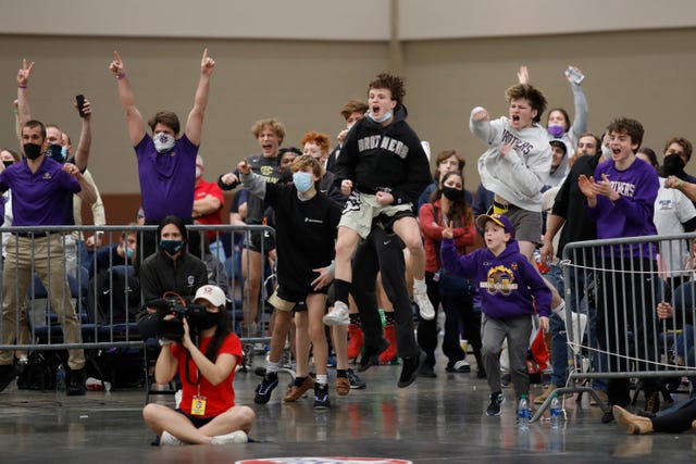 Fans cheer during TSSAA state wrestling tournament championships at the Chattanooga Convention Center on Thursday, Feb. 25, 2021, in Chattanooga, Tenn.