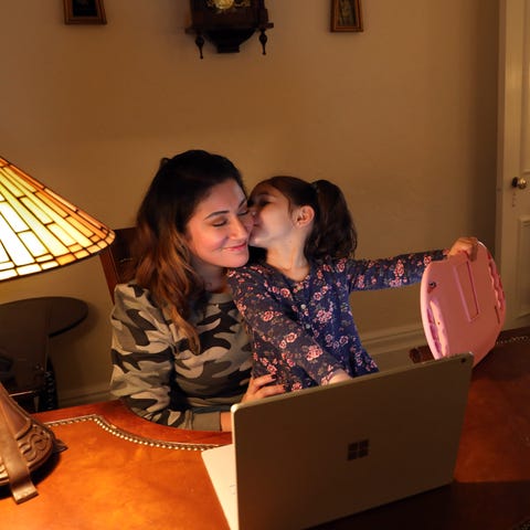 Leslie Chiaramonte gets a kiss from her daughter P
