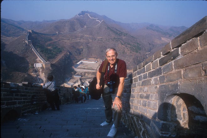 Photographer Lowell Georgia on the Great Wall of China in 1998. Georgia, who began his career with the Green Bay Press-Gazette, worked for National Geographic for many years on more than 125 projects.
