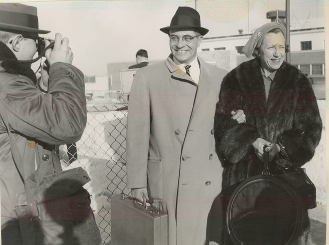 Press-Gazette photographer Lowell Georgia, left, photographs Vince and Marie Lombardi as they arrive in Green Bay for the first time in early 1959.