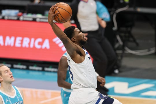 Minnesota Timberwolves guard Malik Beasley drives to the basket against the Charlotte Hornets during the first half of an NBA basketball game in Charlotte, N.C., Friday, Feb. 12, 2021. (AP Photo/Nell Redmond).