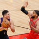 Feb 26, 2021; Chicago, Illinois, USA; Phoenix Suns guard Devin Booker (1) is defended by Chicago Bulls guard Garrett Temple (17) during the first half of an NBA game at United Center. Mandatory Credit: Kamil Krzaczynski-USA TODAY Sports