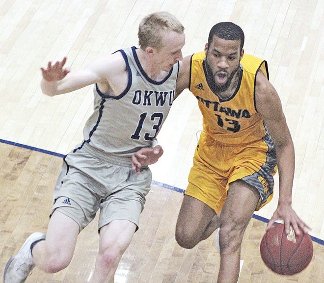 Oklahoma Wesleyan's Kazden Ammons, left, tries to shut down Ottawa University's Ty Bland, during one of the man close encounters in Saturday's regional semifinal game.