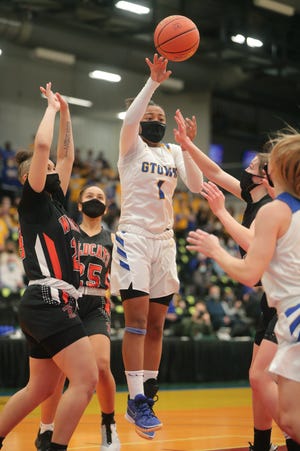 Germantown's KK Arnold dumps off a pass during the second half of their WIAA Division 1 semifinal game against Verona.