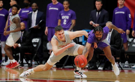 Jovan Blacksher Jr., dives for a loose ball in Grand Canyon's 81-71 win Saturday night over Seattle University. Photo by David Kadlubowski.