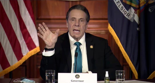 In this image taken from video, New York Gov. Andrew Cuomo speaks during a news conference Friday, Feb. 19, 2021, in Albany, N.Y. Cuomo and his health commissioner offered a full-throated defense Friday of their March decision to require nursing homes to accept patients recovering from COVID-19,