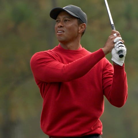 Tiger Woods follows plays during the final round o
