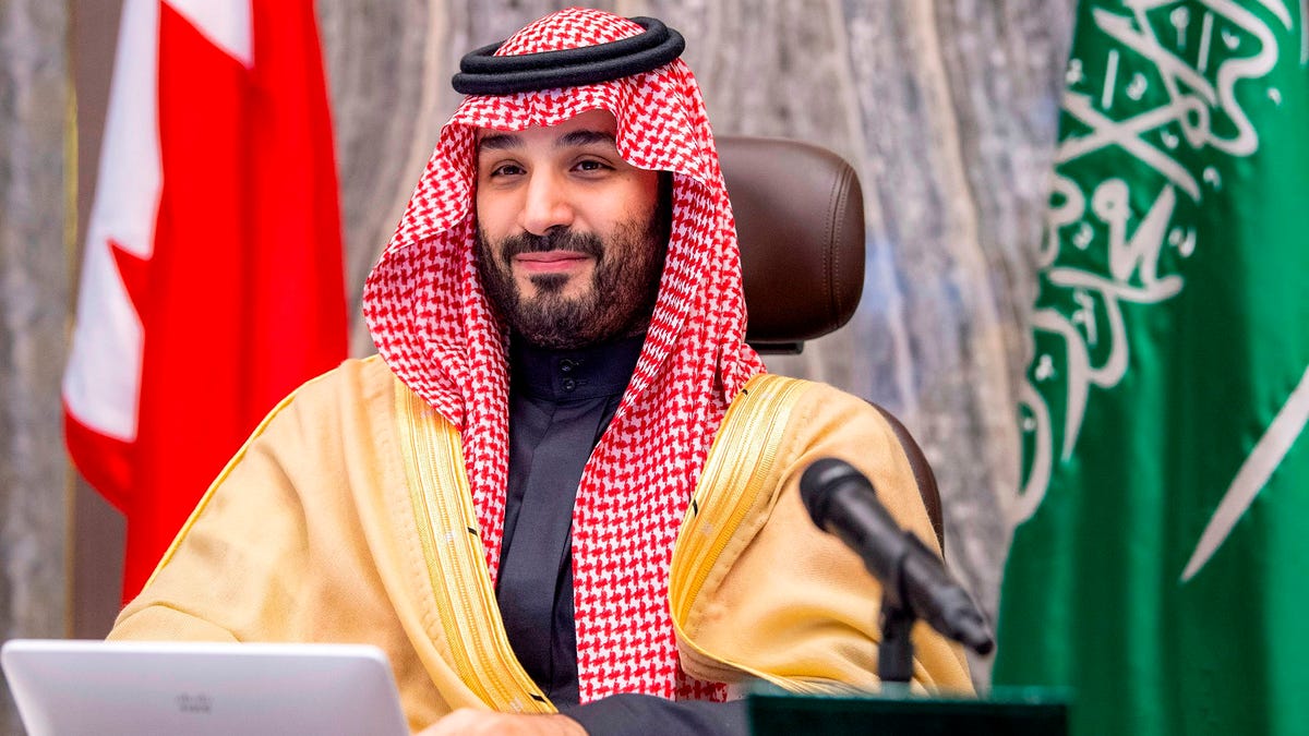 A handout picture provided by the Saudi Royal Palace on Dec. 24, 2020 shows Saudi Crown Prince Mohammed bin Salman attending by videoconference a meeting with Bahrain's Crown Prince of the Saudi-Bahraini Coordinating Council.