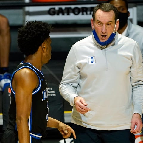 Duke head coach Mike Krzyzewski talks to guard Jer