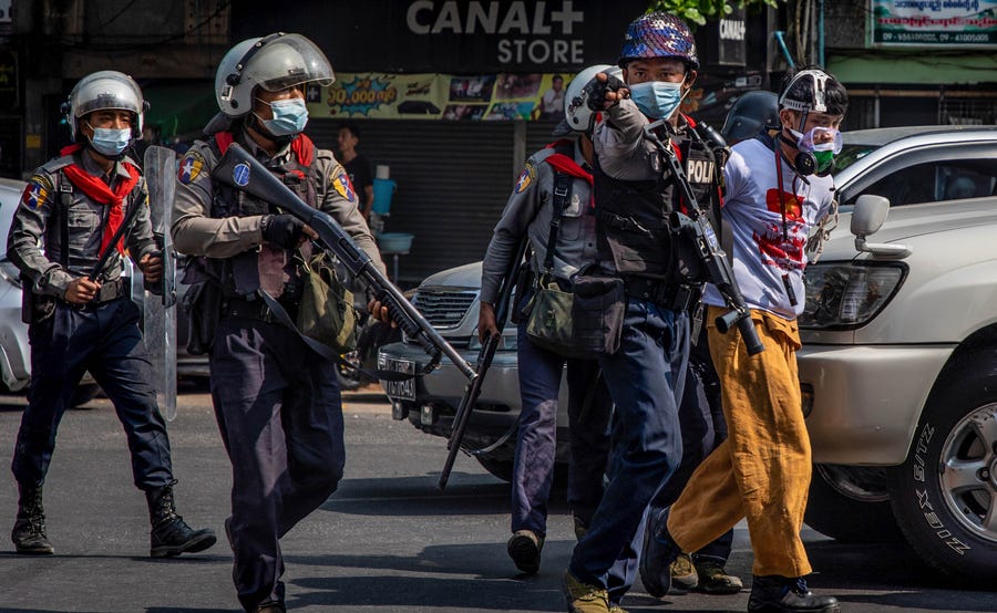 Riot police arrest protesters Feb 27 in Yangon, Myanmar. The military government has intensified a crackdown on demonstrations.